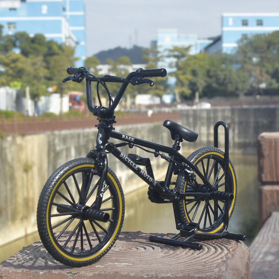 Close-up on handlebars and wheels highlights BMX-inspired detailing