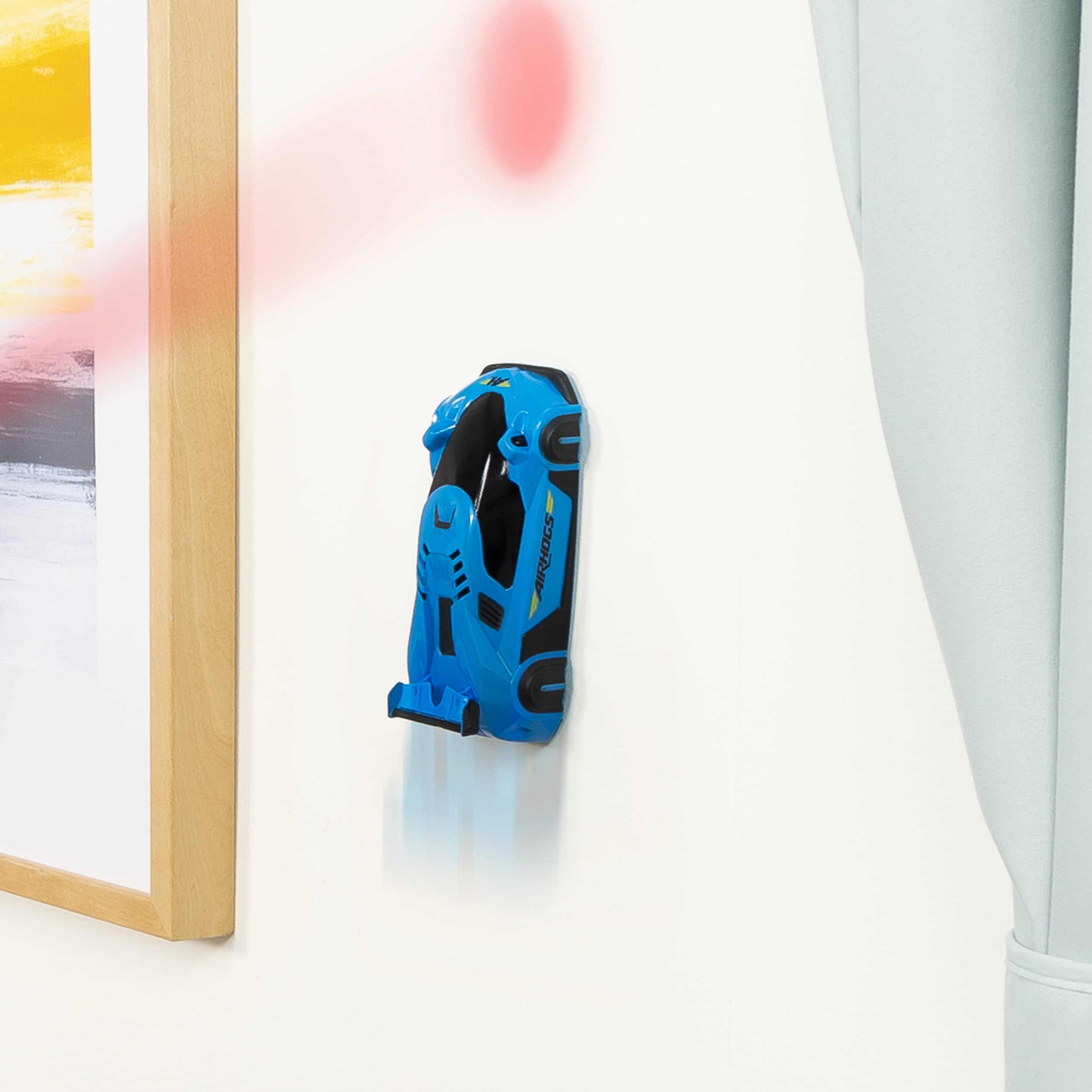 Air Hogs Wall Racer on ceiling demonstrates gravity-defying racing thrills.