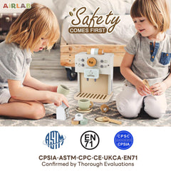 Airlab child uses the pretend coffee set to serve coffee to a plush friend.