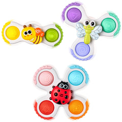 ALASOU pop suction spinner on fridge supports quiet, focused play during mealtime.