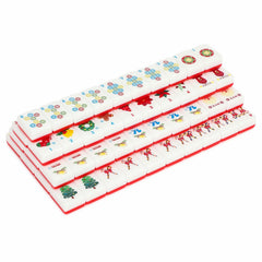Festive Mahjong scene with Christmas-themed tiles and family play.