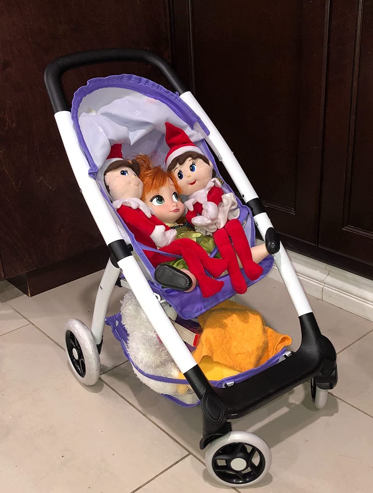 ANIVIA Baby Doll Stroller hood shields the doll from sun during outdoor play.