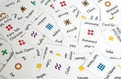 Anomia card game on table shows social interaction and rapid category thinking.