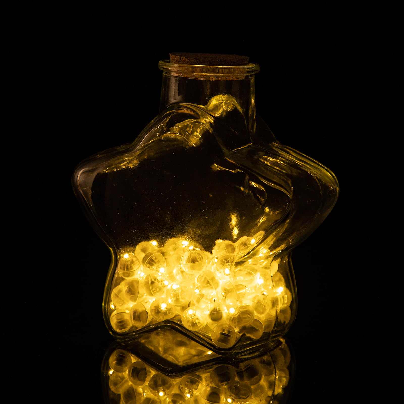 Aogist balloon light shown inside a vase as a centerpiece glow.