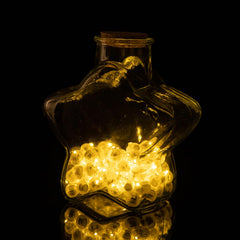 Aogist balloon light shown inside a vase as a centerpiece glow.
