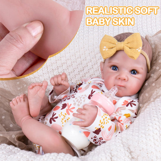 Aori reborn doll in newborn outfit invites dressing and nurturing role-play.
