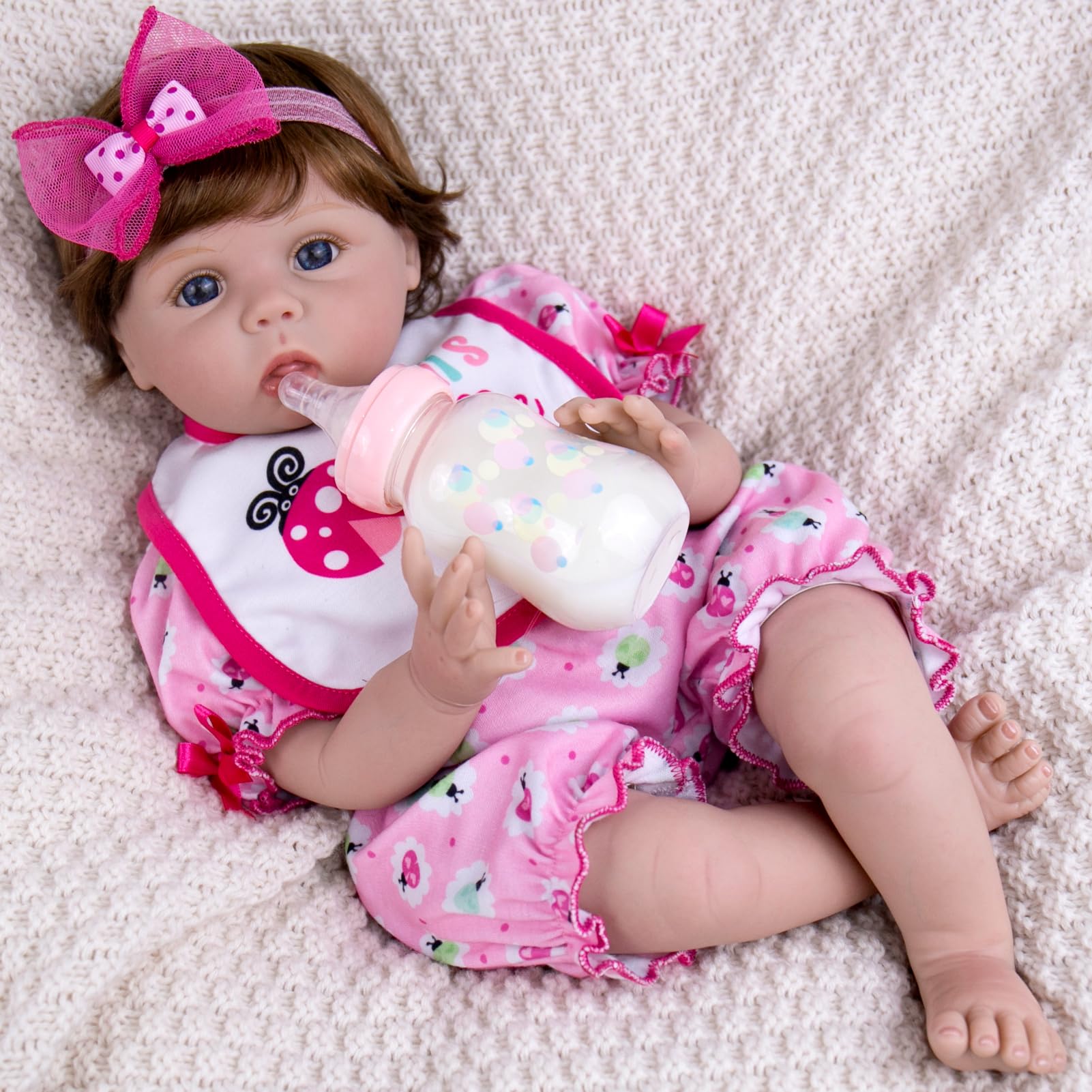 Aori lifelike reborn baby doll face detail shows natural skin tones for authentic play.