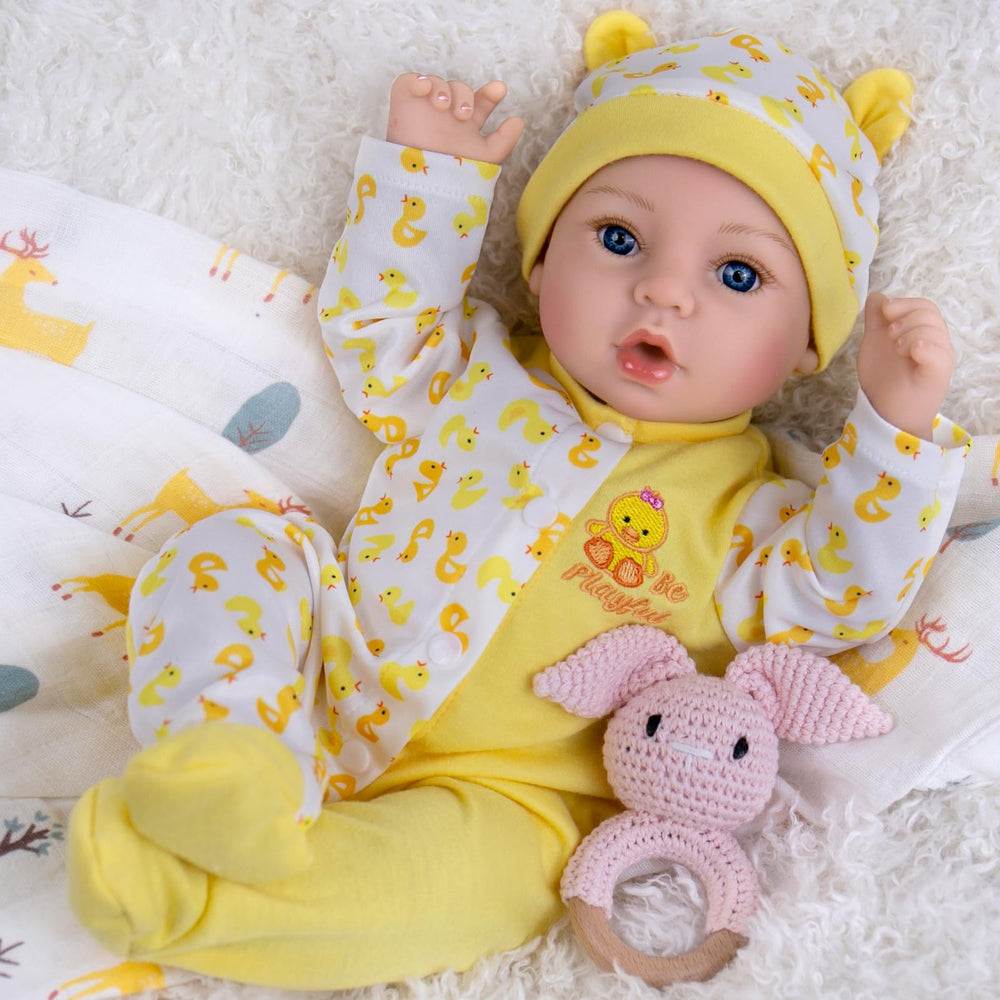 Aori Realistic Reborn Baby Doll wearing a yellow outfit ready for cuddling and play.