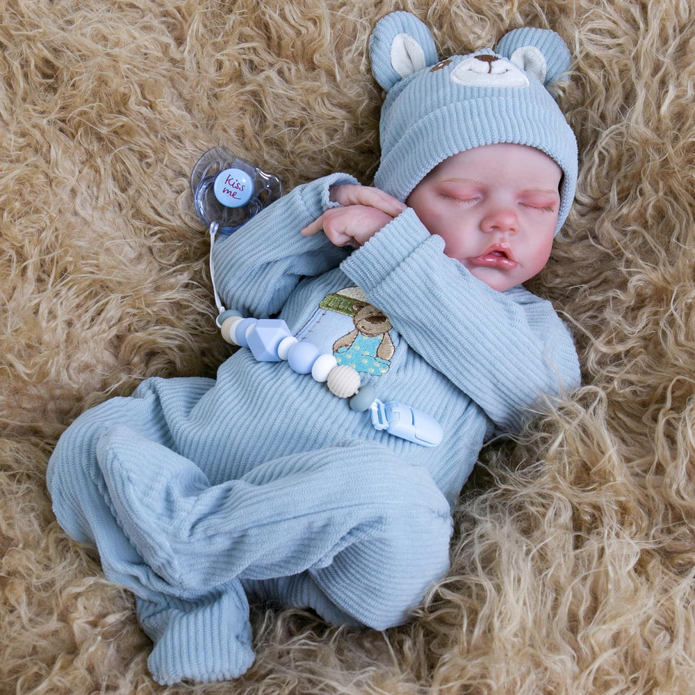 Aori Reborn Baby Doll Boy weighted body provides realistic hold during pretend caregiving