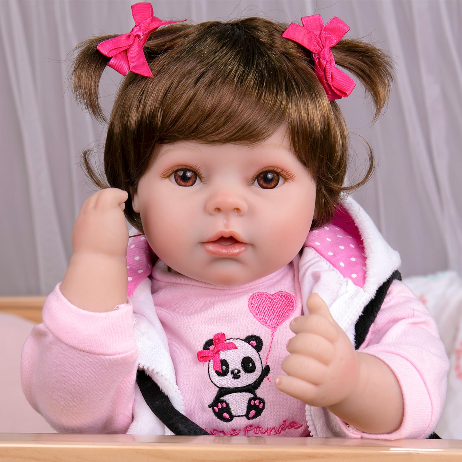 Aori Reborn doll with hand-applied wig for versatile styling.