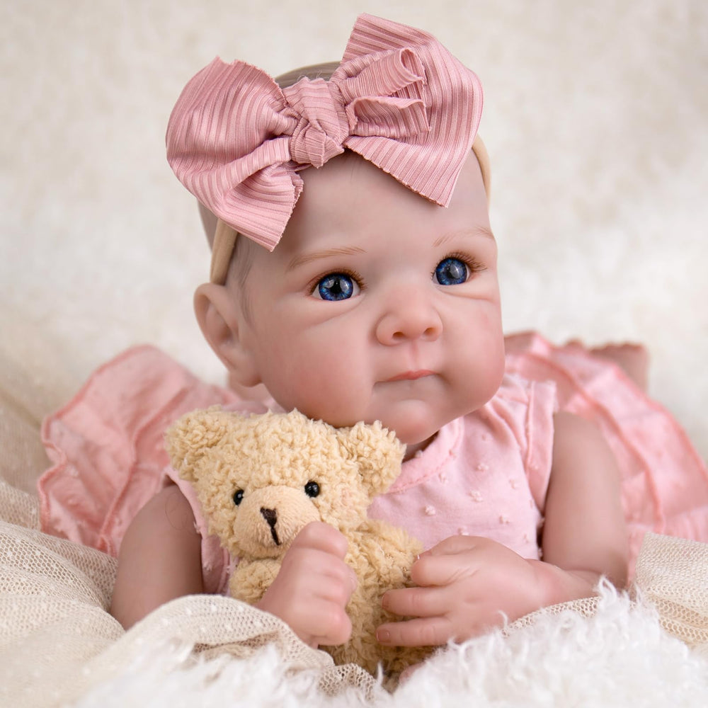 Aori Reborn 20in cloth body highlights cuddly feel for nurturing play.
