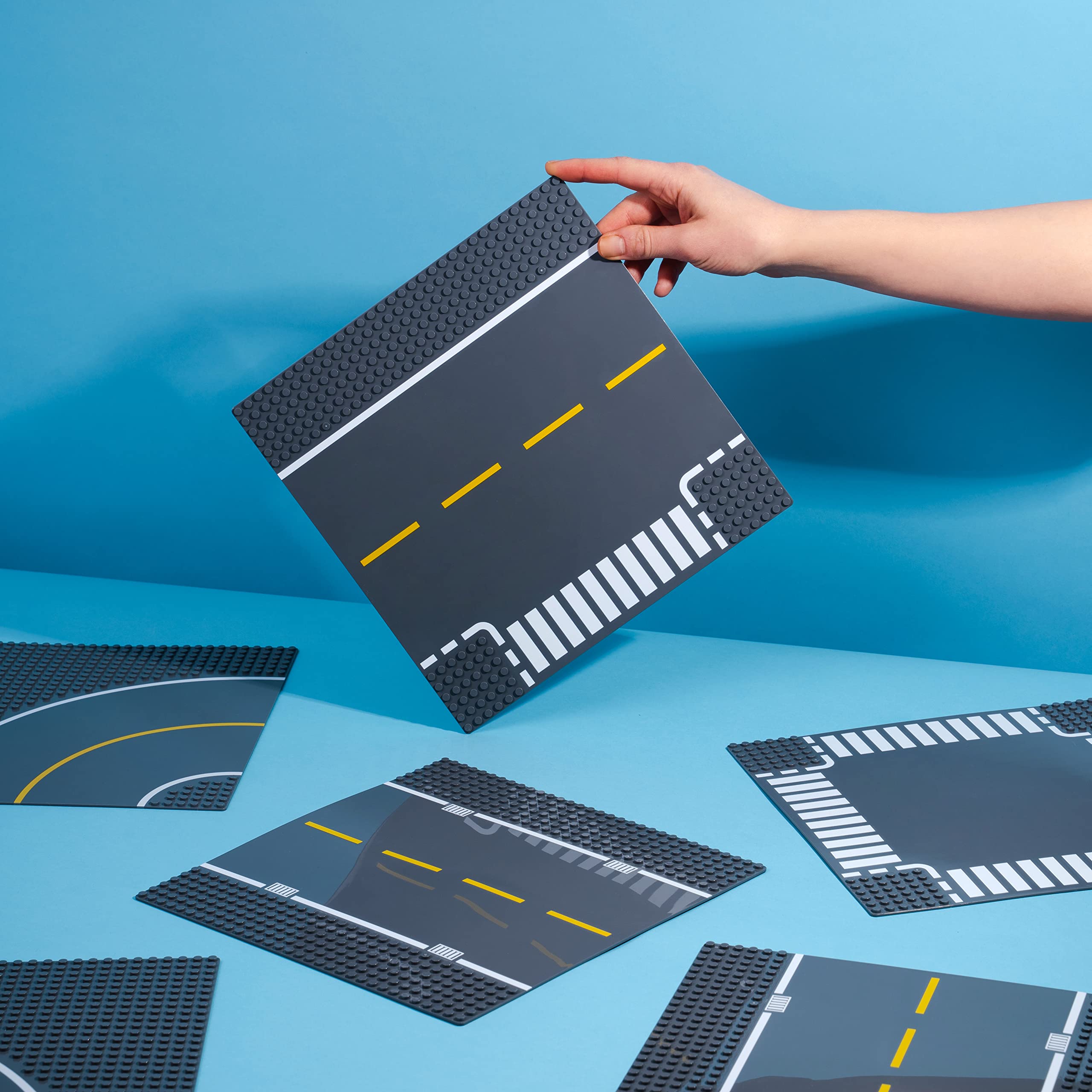 Apostrophe Games crossroad baseplate forms realistic intersections in your town.