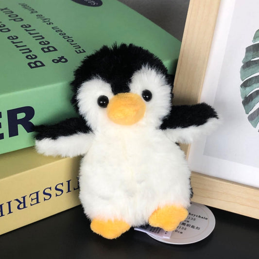 Apricot Lamb penguin keychain side view shows soft plush texture for daily use.