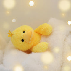 Apricot Lamb velvet duck plush held in arms, comforting bedtime companion.