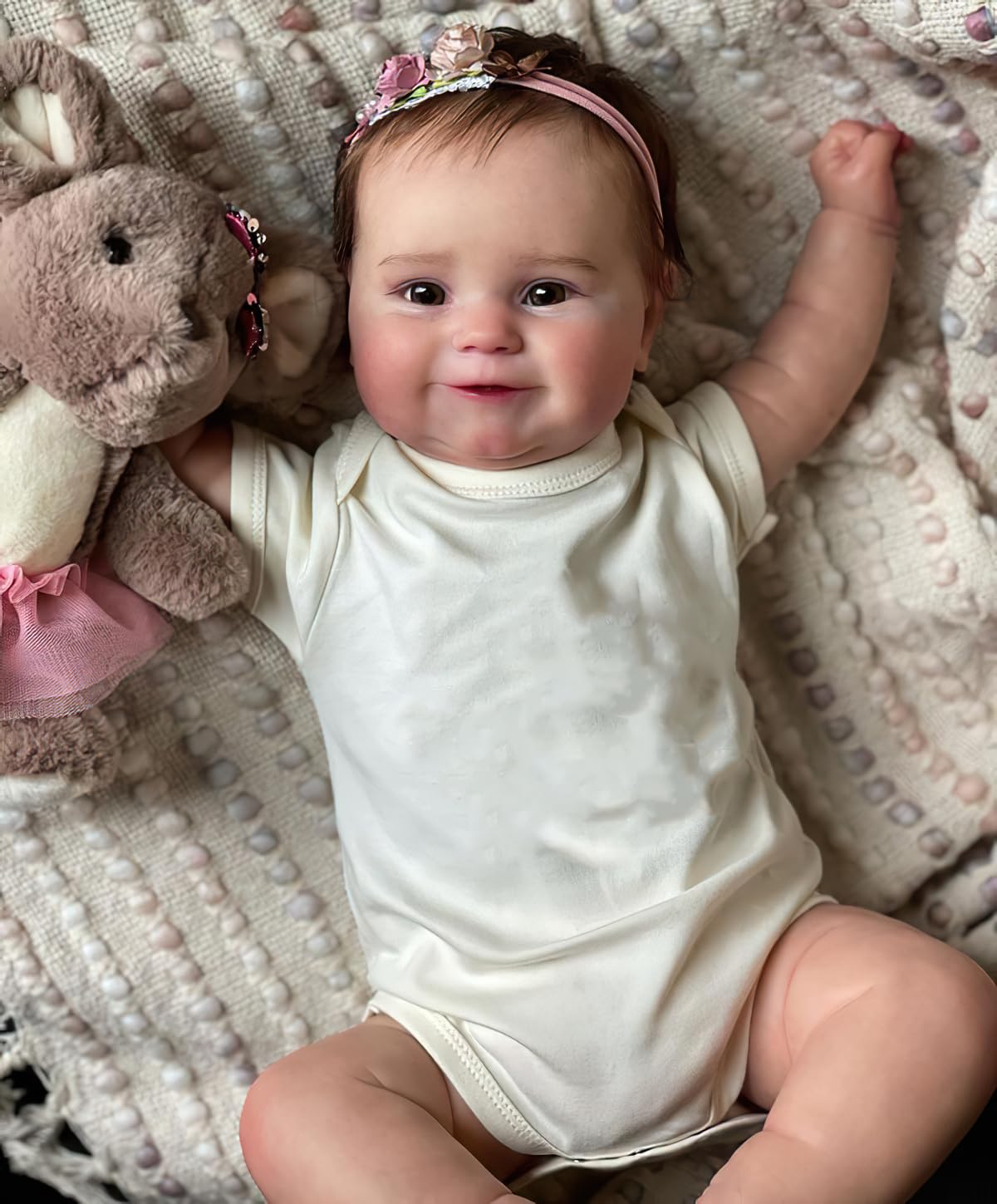 Ardol 20-inch reborn doll with a smiling face for collecting or lifelike play.