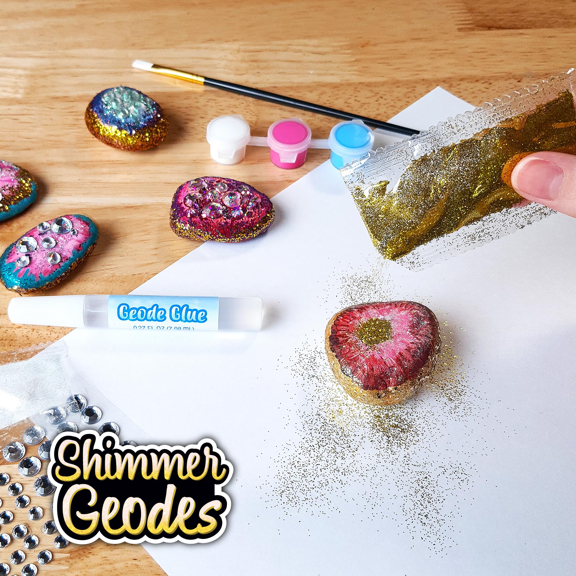 ArtSkills glitter and gem stickers add sparkle to rock art.