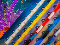Asmodee Ticket to Ride players planning routes during game night.