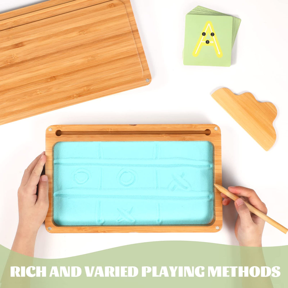 AtMini wooden pen supports smooth letter formation in sand.