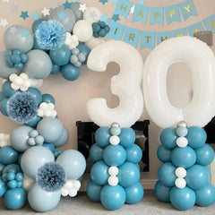 Aurasys blue, gold, and ivory star balloons enhance themed décor.