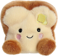 Aurora Buttery Toast Palm Pal in hand, cuddly friend for on-the-go play.