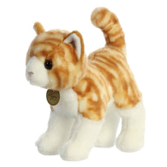 Aurora Miyoni orange tabby plush decor in a bedroom setting.
