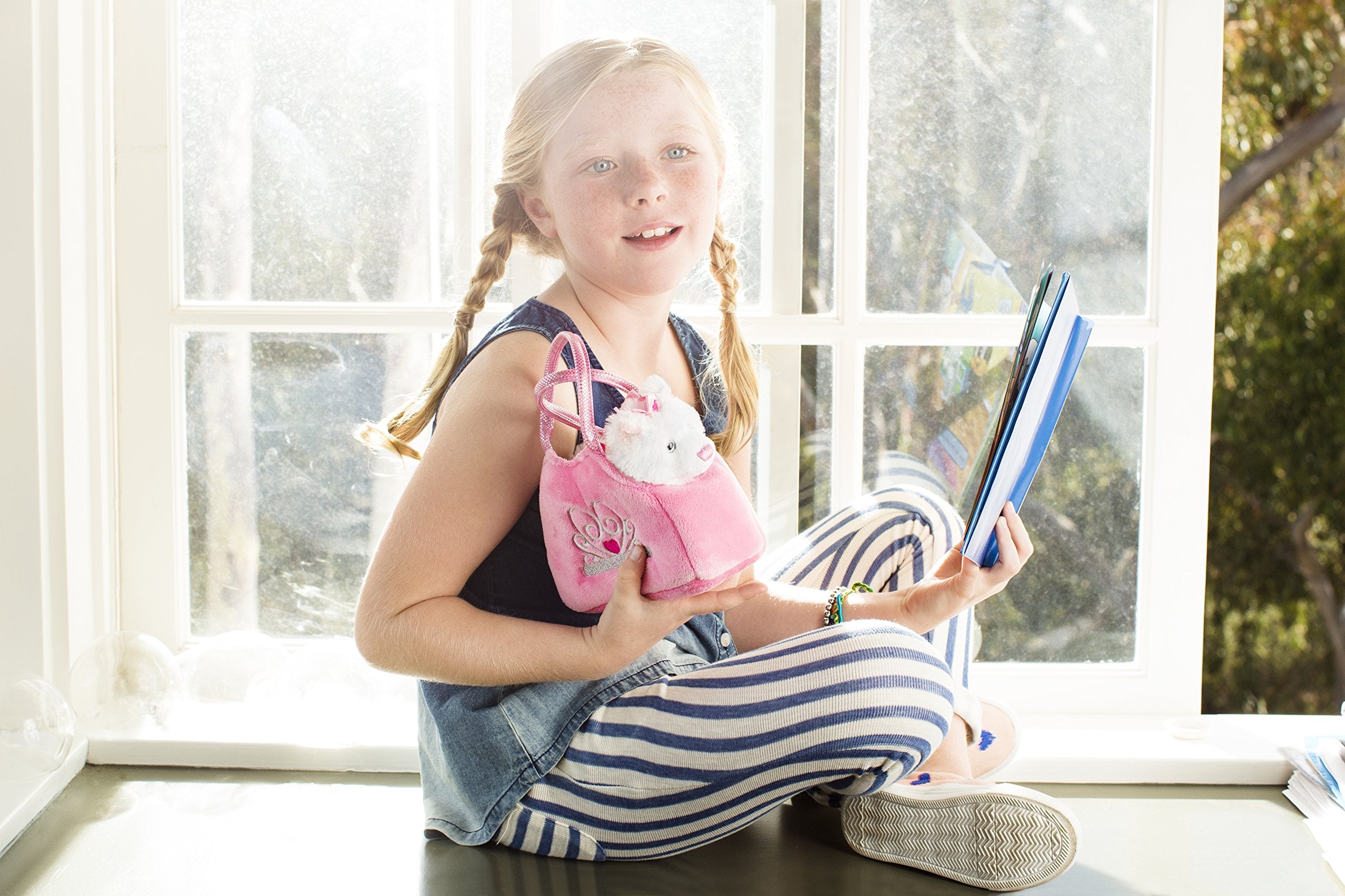 Removable princess kitten plush from pink carrier for imaginative play