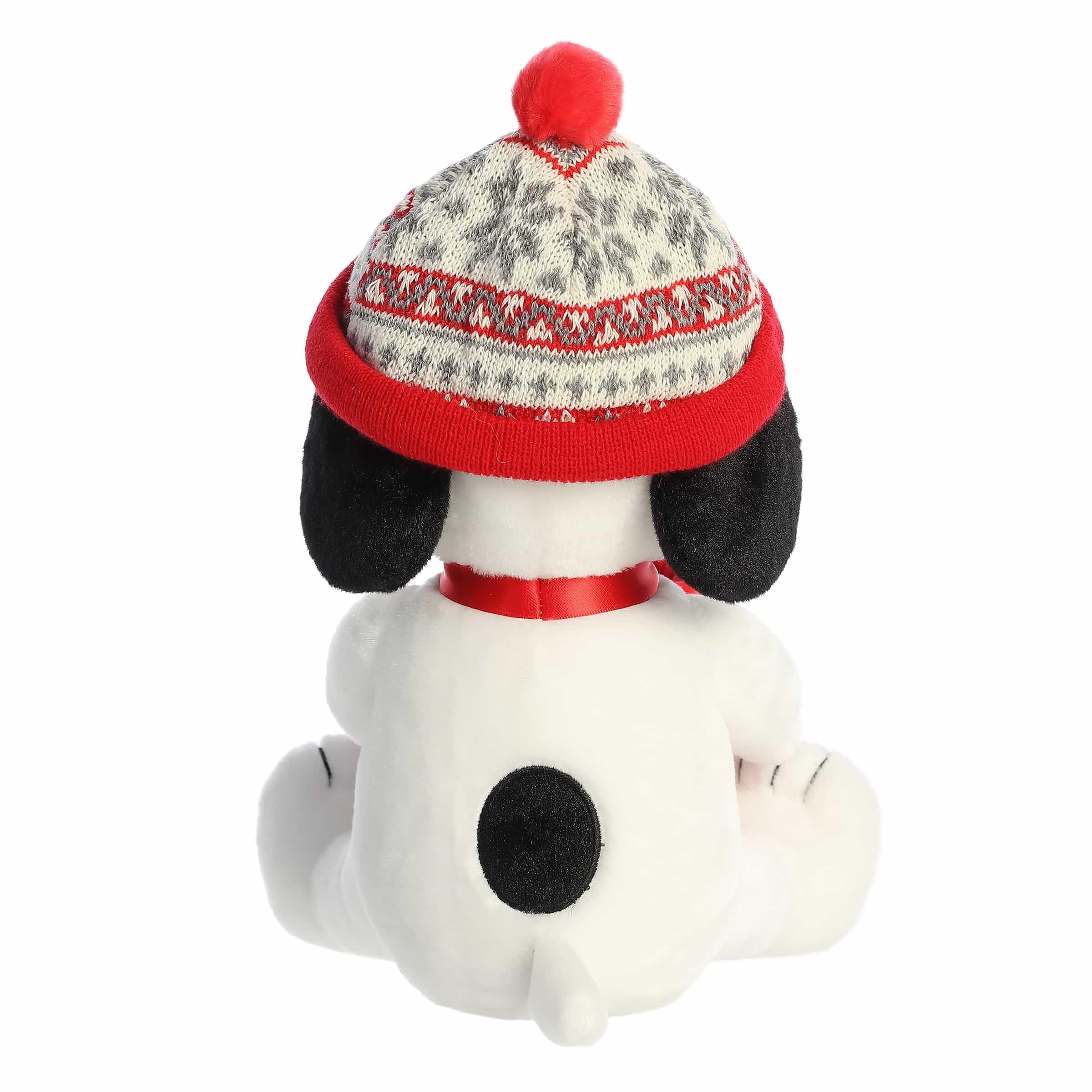 Aurora Snoopy stuffed animal wearing holiday hat, ideal as a cozy gift for Peanuts fans.