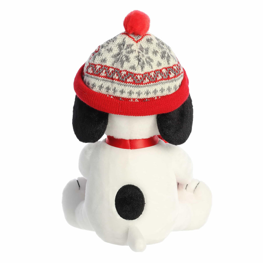Aurora Snoopy stuffed animal wearing holiday hat, ideal as a cozy gift for Peanuts fans.