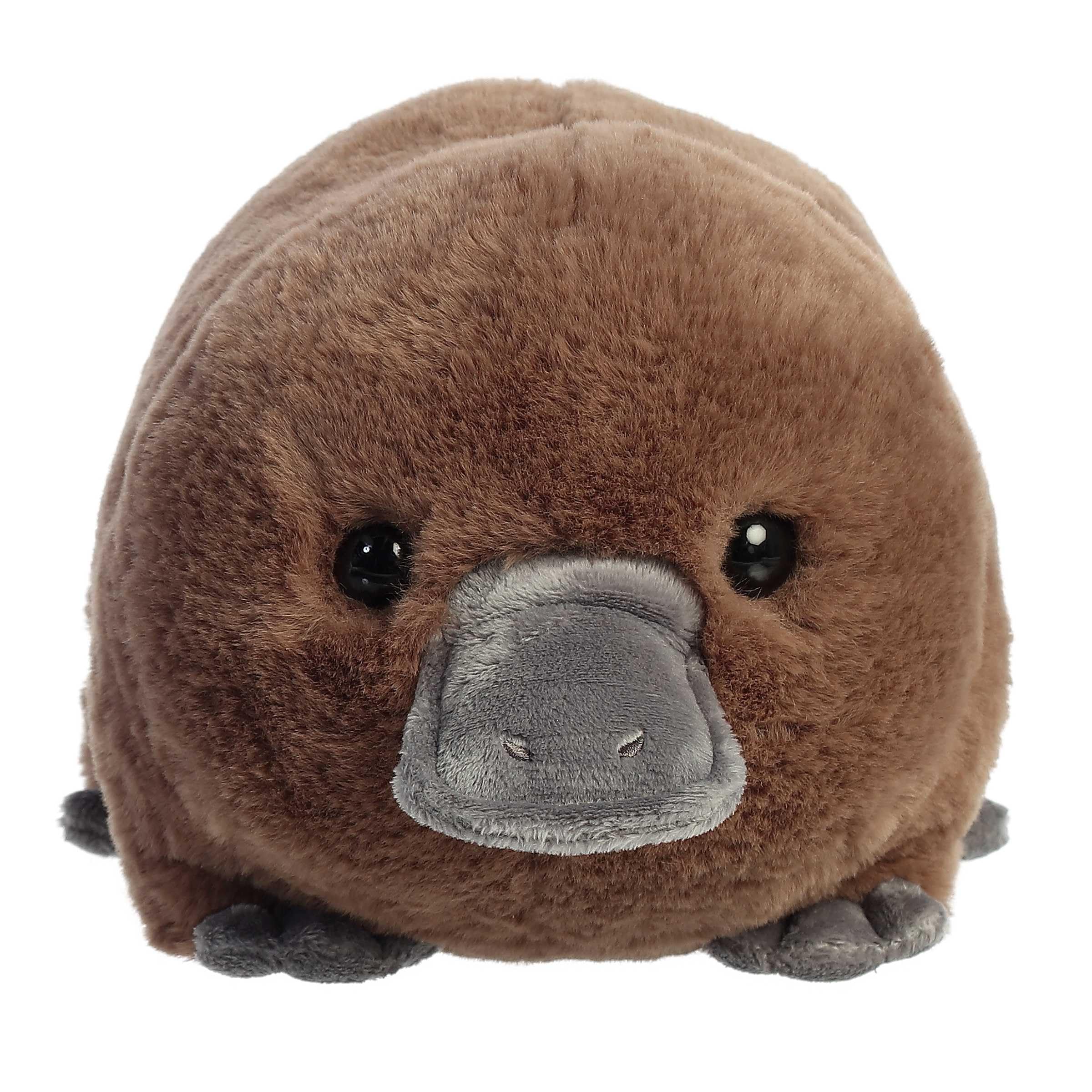Aurora Spudsters Pongo Platypus plush in warm brown with gray feet for tactile warmth.