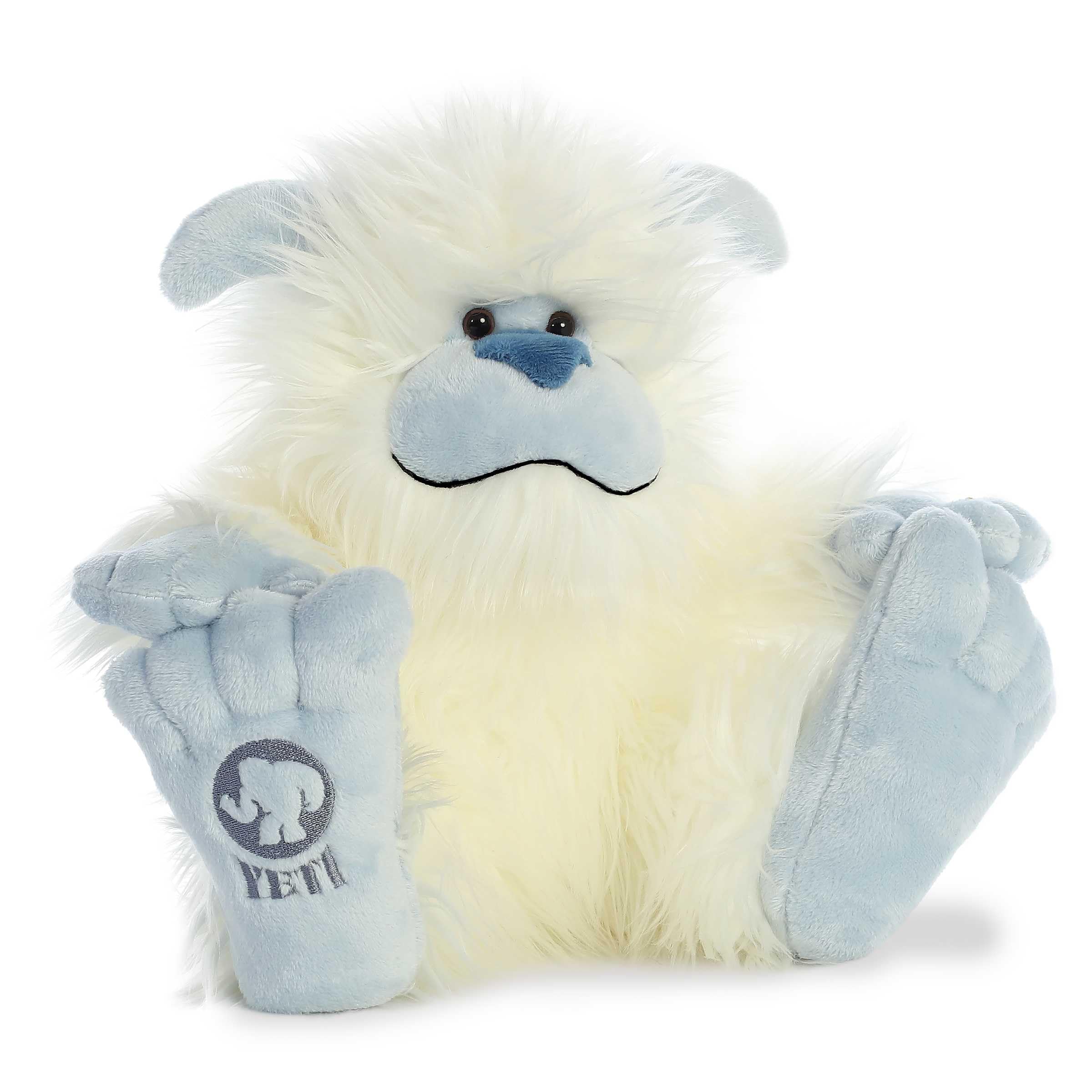 Aurora Yeti plush in white fur, perfect bedtime companion for cozy storytelling.