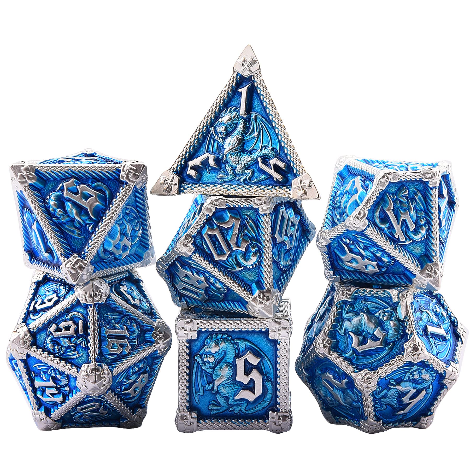 Close-up of AUSTOR dragon engraving on metal dice, showcasing craftsmanship.