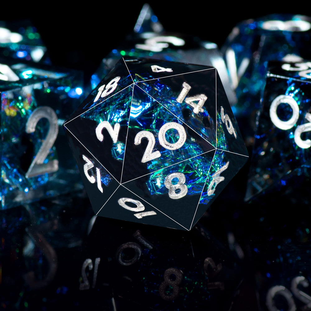AUSTOR Dark Star resin dice featuring gold inner foil and shifting colors.
