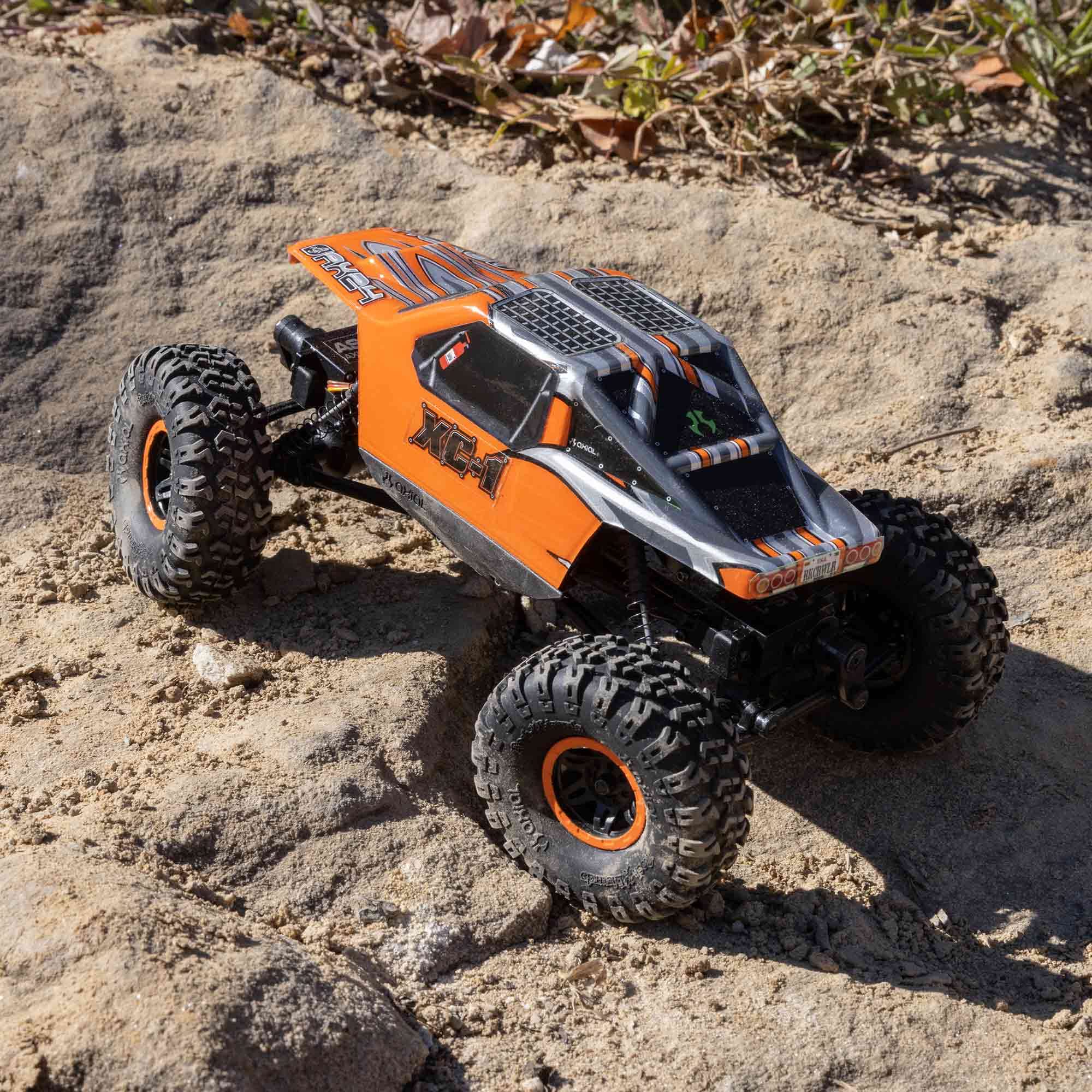 Axial AX24 XC-1 rock-lizards tires boost grip across dirt, roots, and ruts.