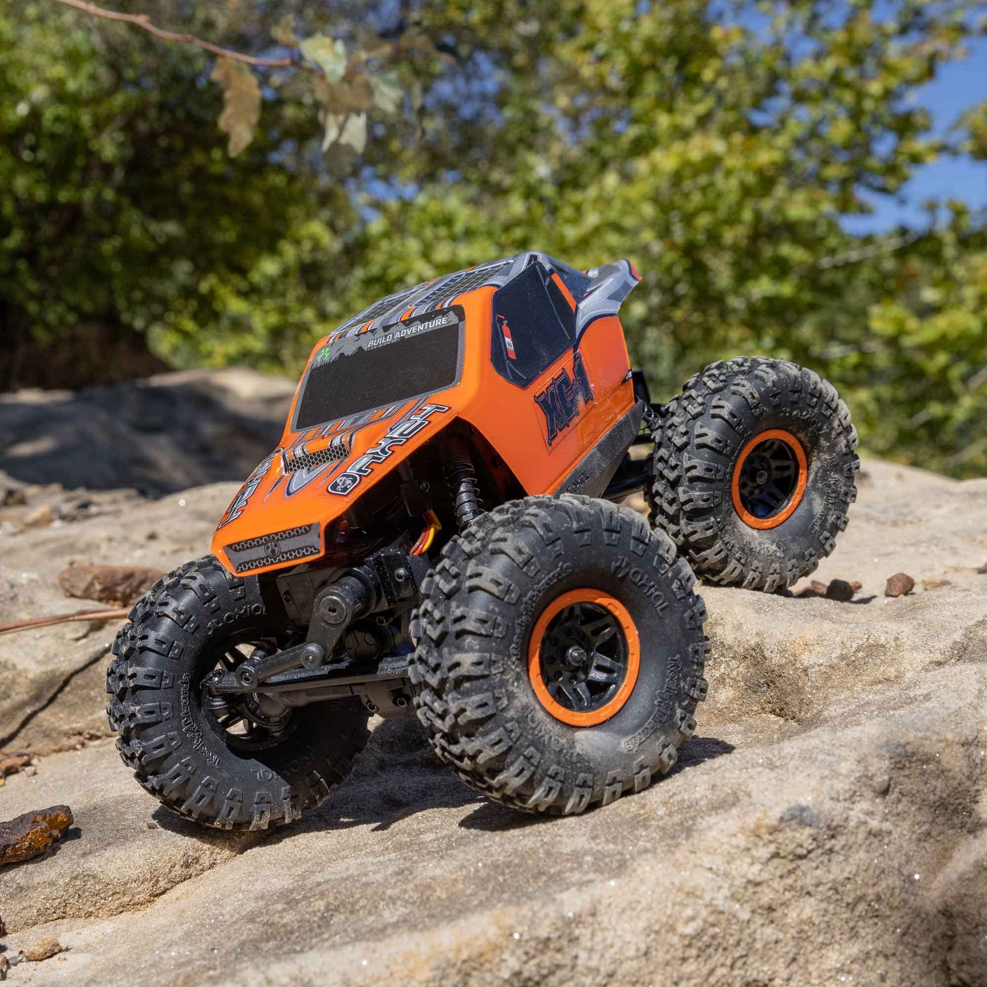Axial AX24 XC-1 rock-slider LED lights illuminate the path in low light.