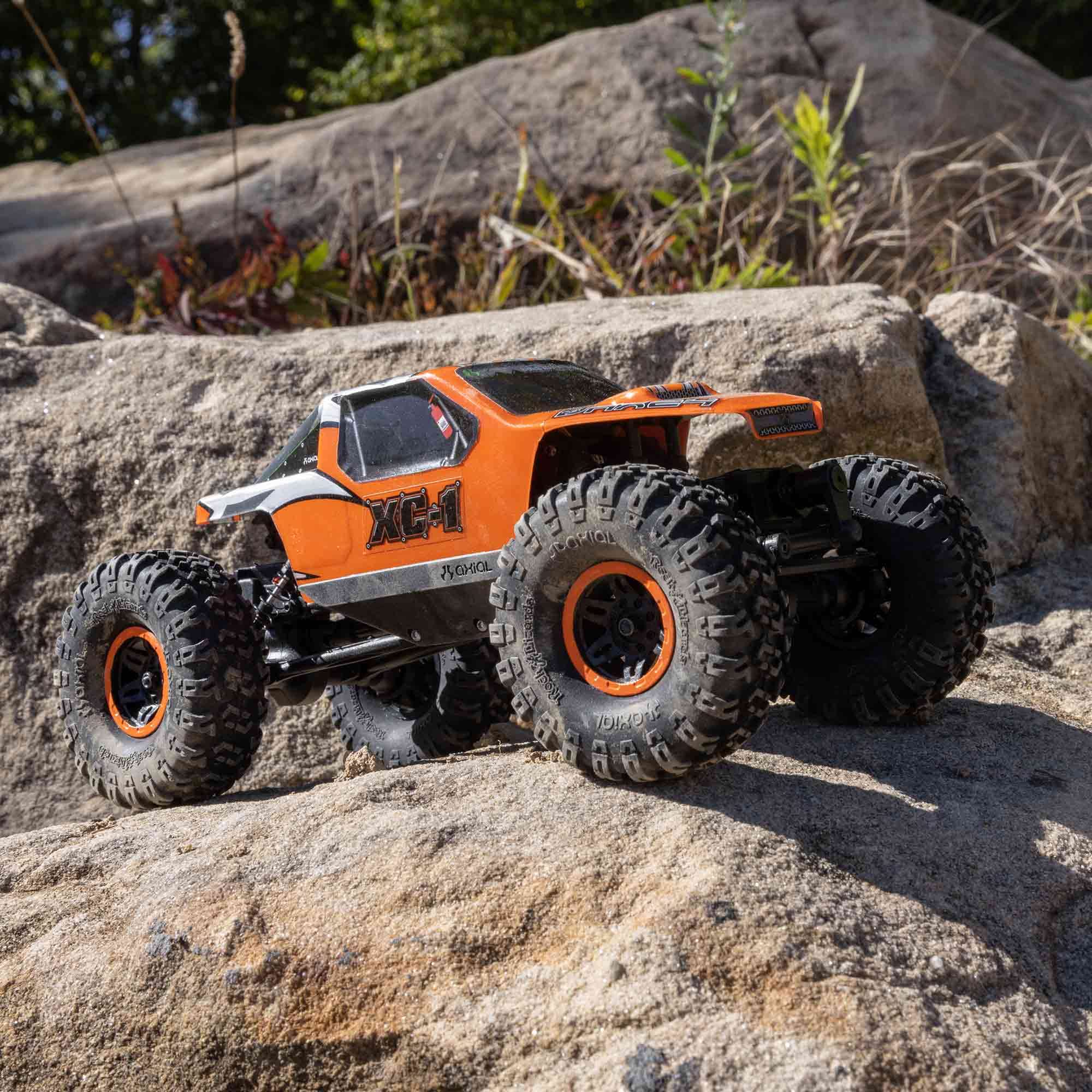 Axial AX24 XC-1 side profile with 4WS highlights precise control on uneven terrain.
