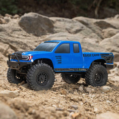 Axial Base Camp 4x4 truck side view highlights compact footprint for versatile indoor or outdoor runs.