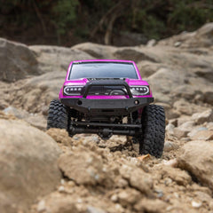 Axial Base Camp pink wheel close-up showing durability and realism