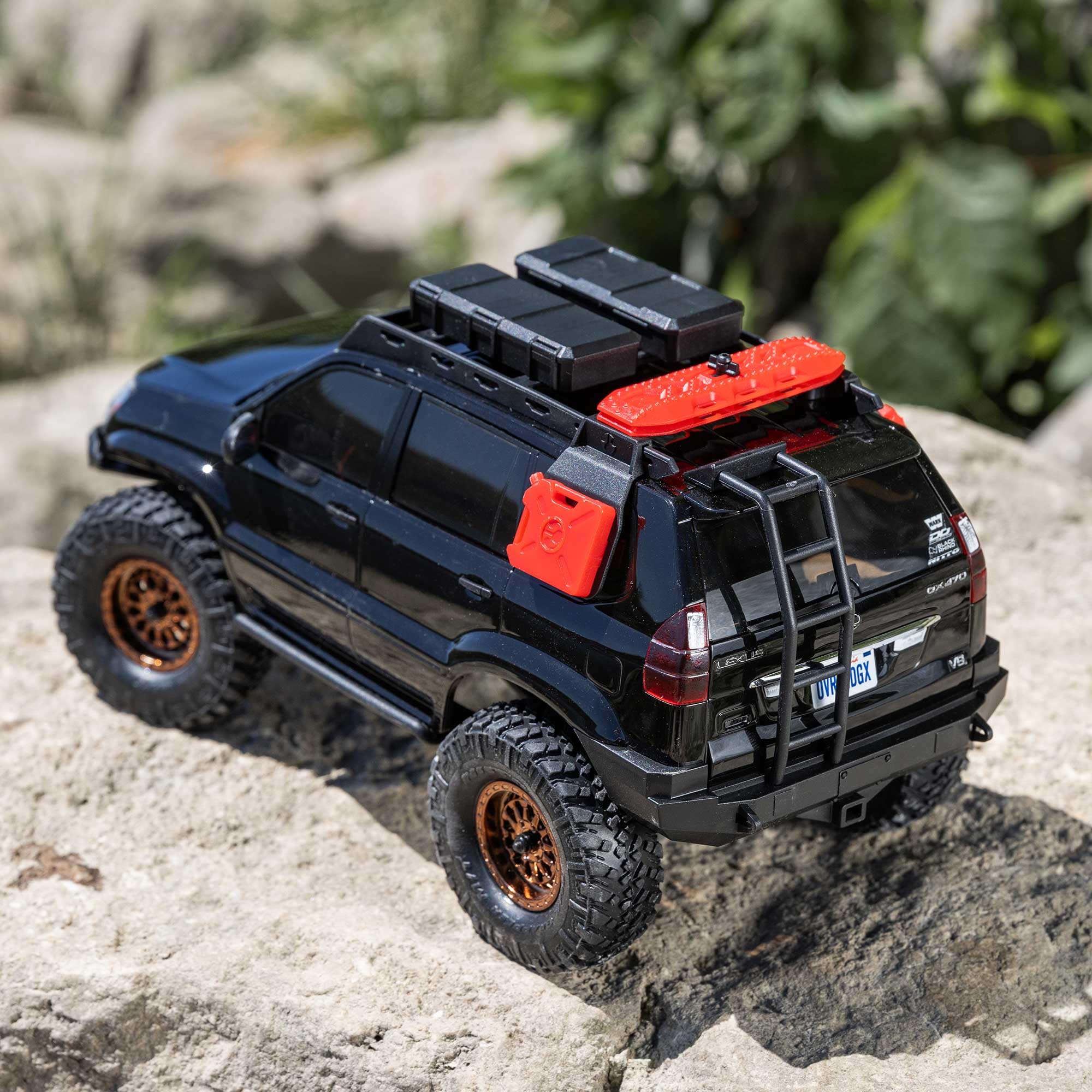 Axial SCX24 Lexus GX470 oil-filled shocks for smooth off-road control.