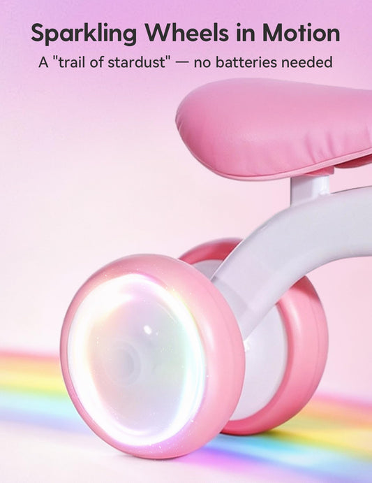 Colorful lighting wheels on the BABELIO unicorn balance bike glow during play