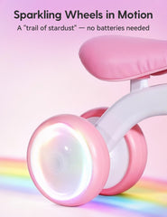 Colorful lighting wheels on the BABELIO unicorn balance bike glow during play