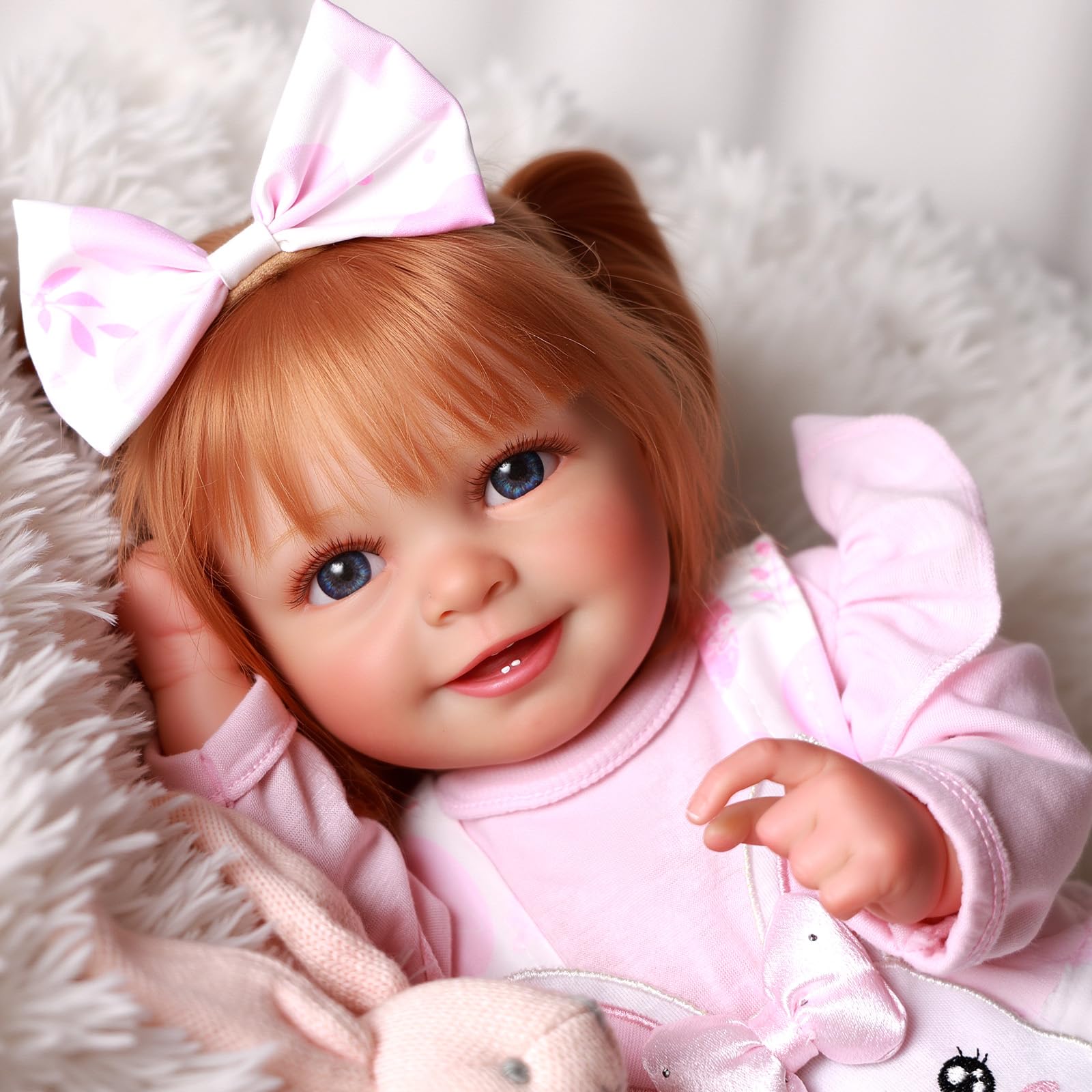 BABESIDE Doreen open-mouth smile enhances gentle pretend play.