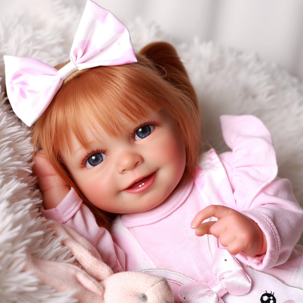 BABESIDE Doreen open-mouth smile enhances gentle pretend play.