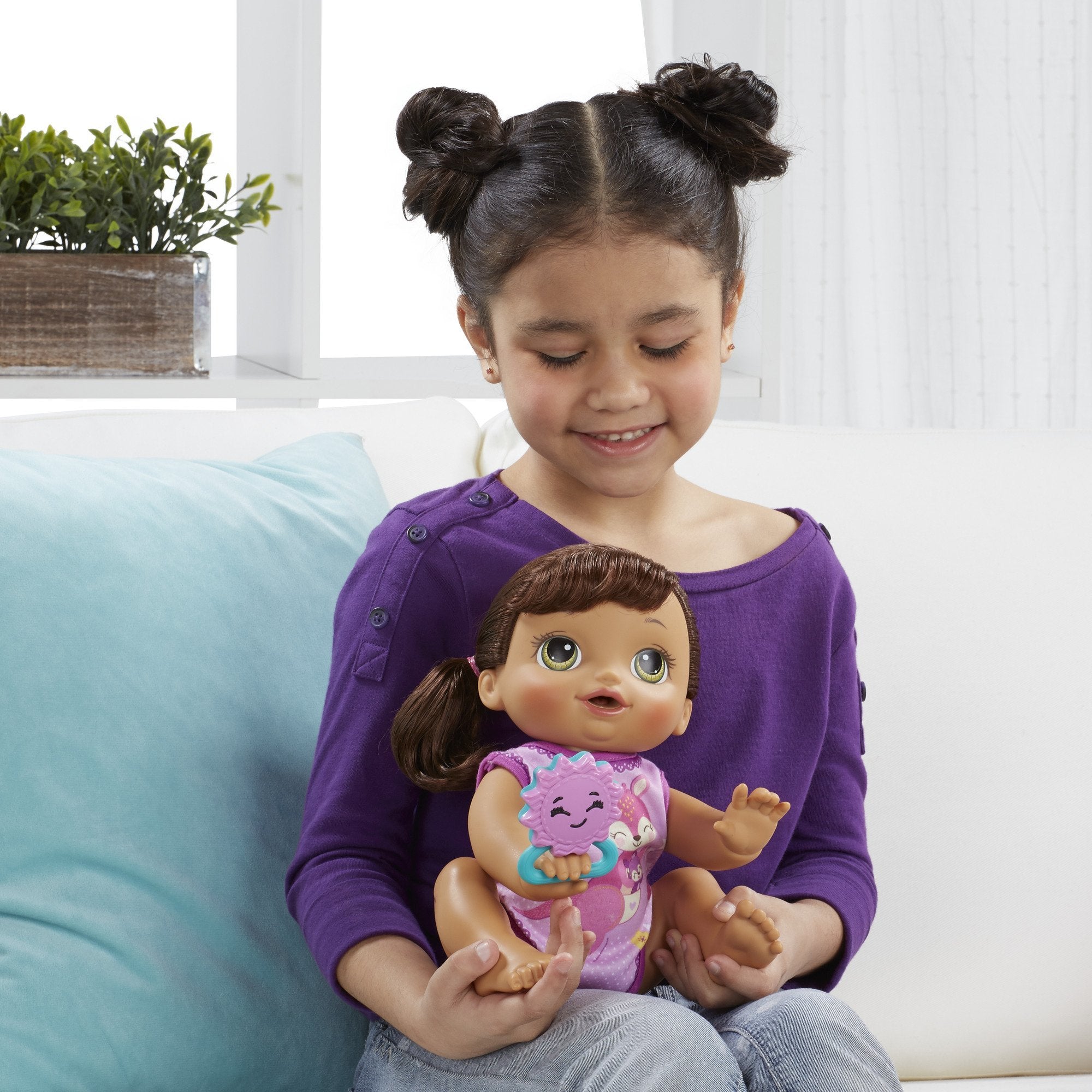 Baby Alive Brunette doll's rooted hair brushes easily for styling fun.