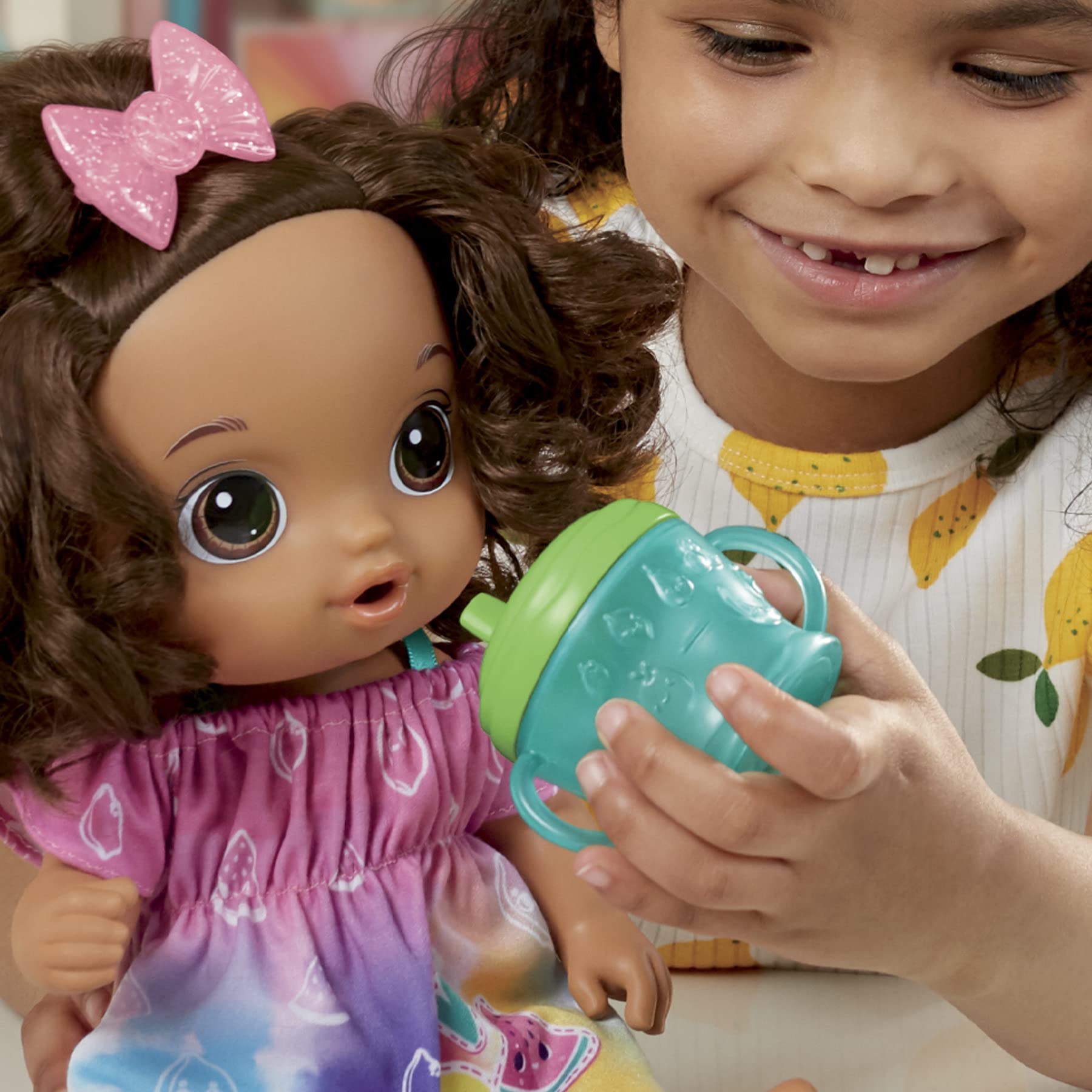 Baby Alive Fruity Sips removable fruit-themed outfit.