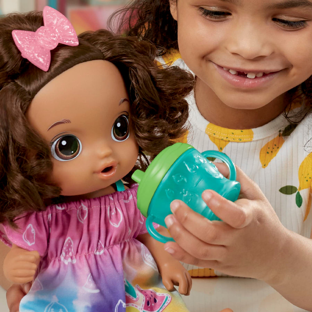 Baby Alive Fruity Sips removable fruit-themed outfit.