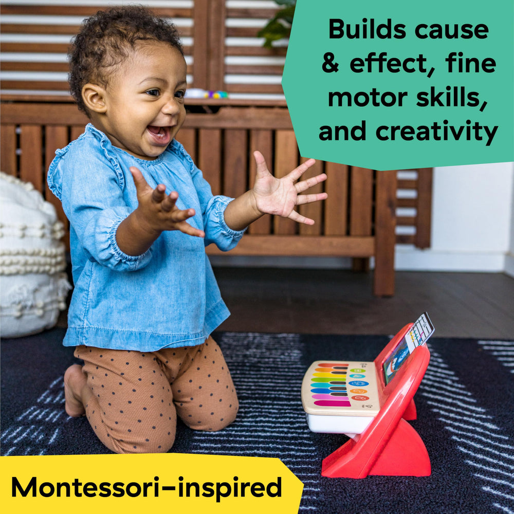 Baby Einstein Cal's First Melodies magic touch wooden surface responds to gentle taps for immediate feedback.