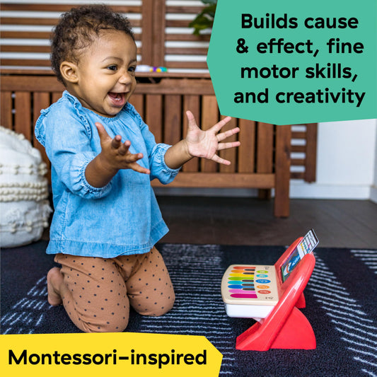 Baby Einstein Cal's First Melodies magic touch wooden surface responds to gentle taps for immediate feedback.