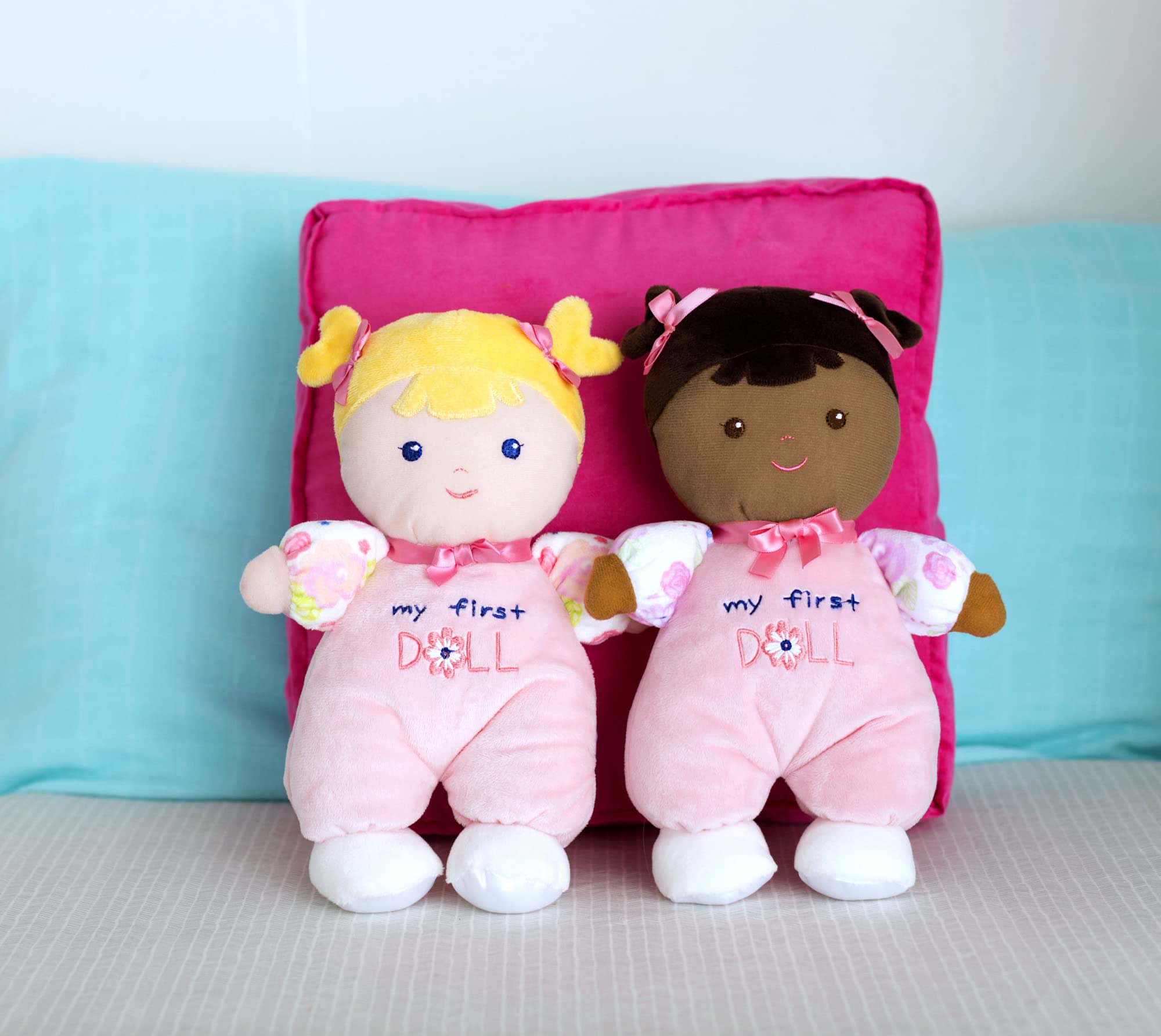 Close-up of blonde Hope embroidery on Baby Starters doll for soothing imaginative play.