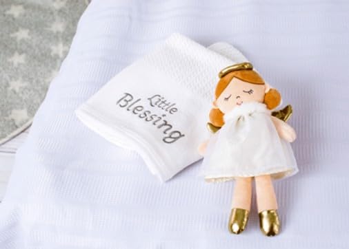 Stella angel doll with golden wings, a charming baptism keepsake and travel companion.