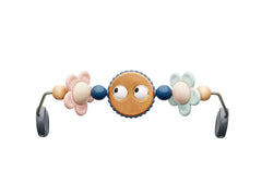 BabyBjörn Googly Eyes Pastels toy bar spins to engage baby during playtime.